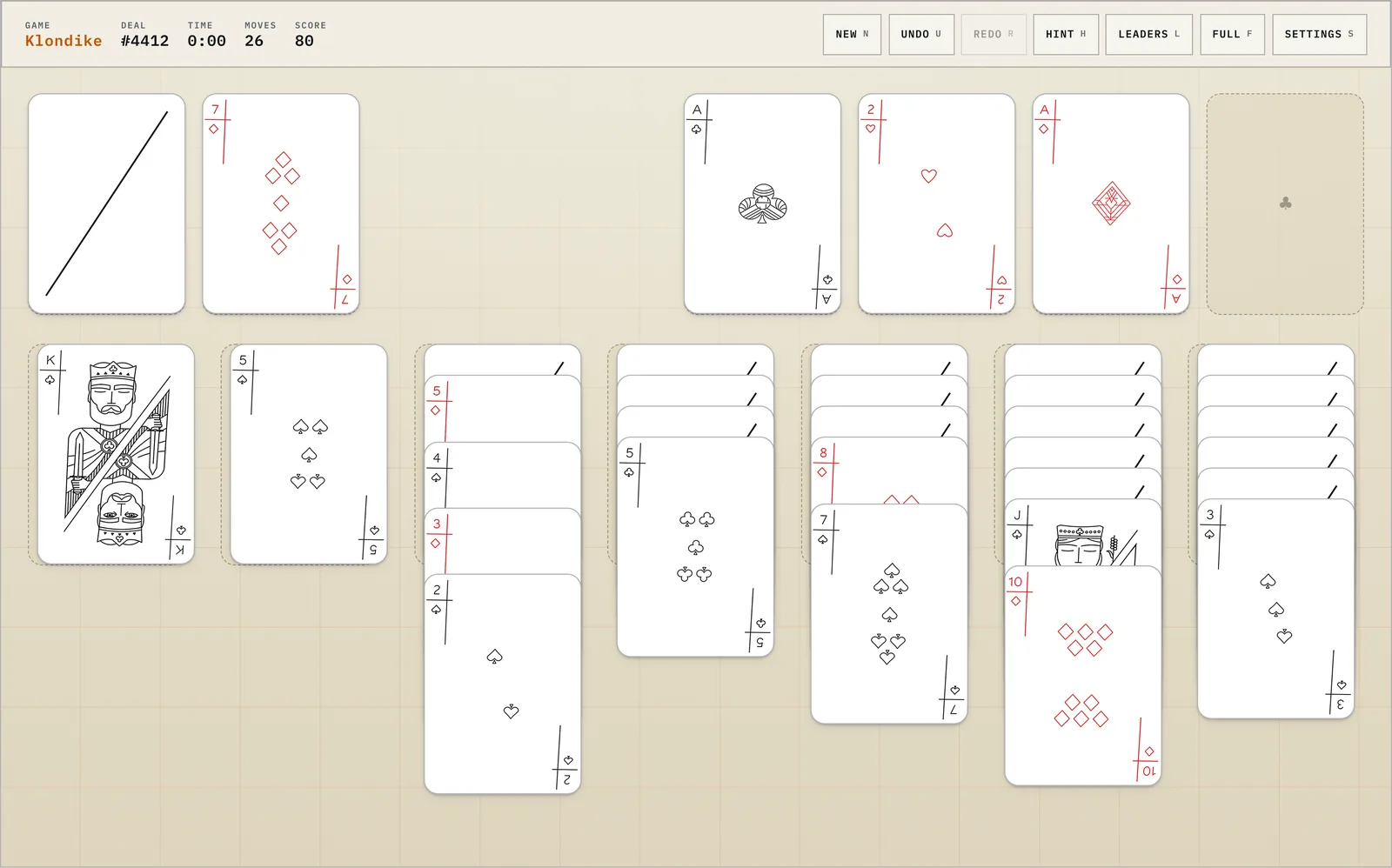 A game of Klondike solitaire in progress, cards laid out in seven tableau columns on a pale felt table