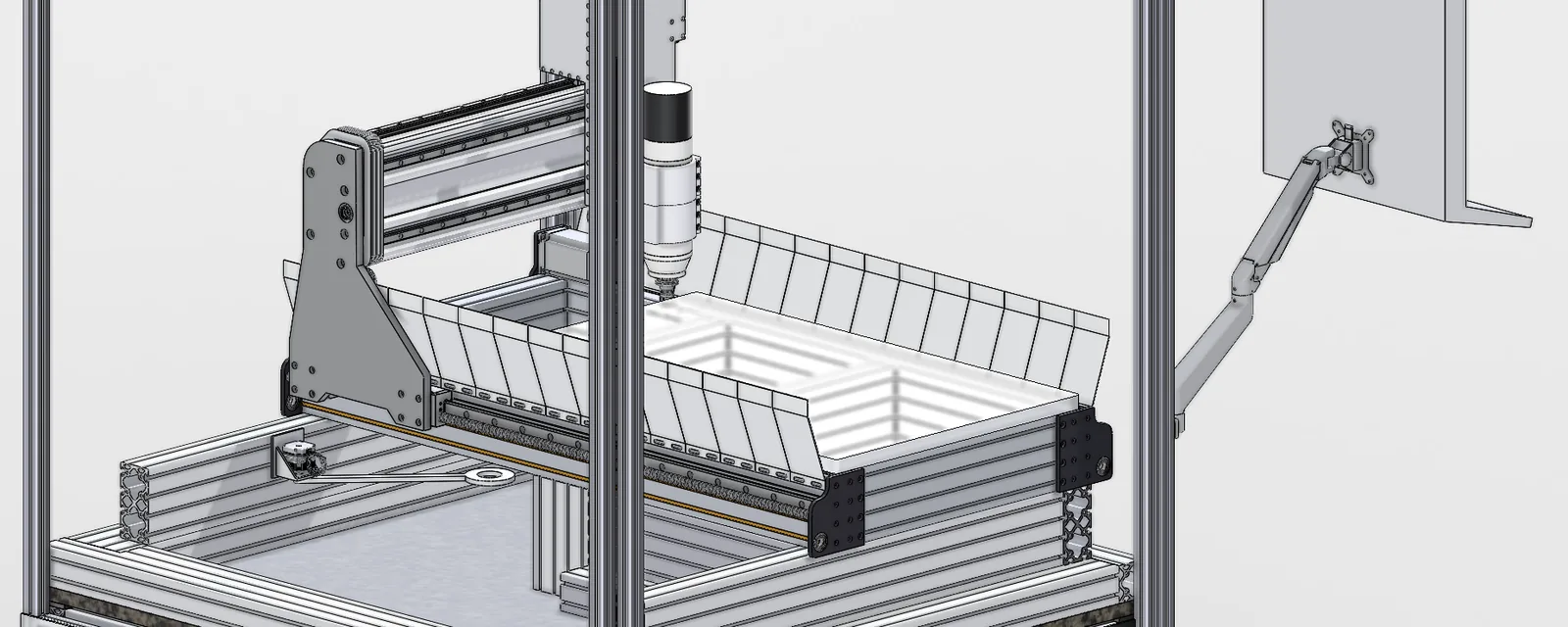 A CAD render of a gantry CNC machine: a grey gantry side plate and beam, a vertical Z column with the spindle, a white vacuum plate edged with pleated panels, and a screen on an arm at the right