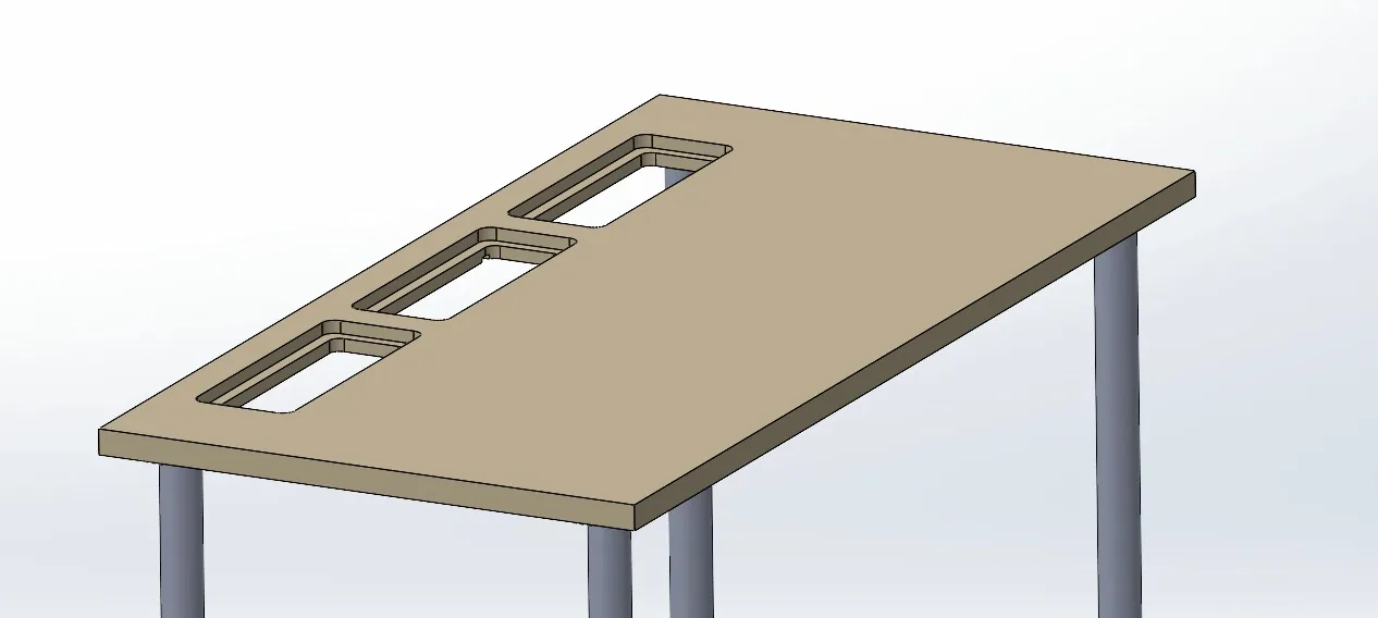 CAD view of a tan desk top on four round grey legs, with three stepped rectangular ports along the back edge