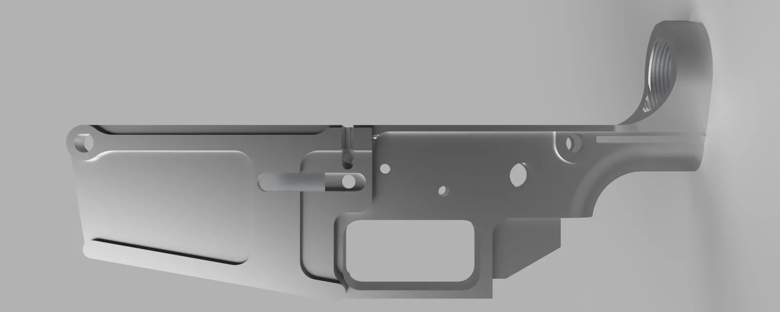 A side-on render of the aluminium lower receiver: a long body with the magazine well on the left, a rectangular trigger guard opening below the middle and a round ring rising at the right end